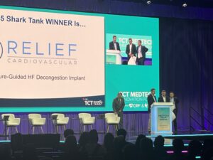 Alex Rothman collects the TCT Shark Tank innovation prize on behalf of Relief Cardiovascular